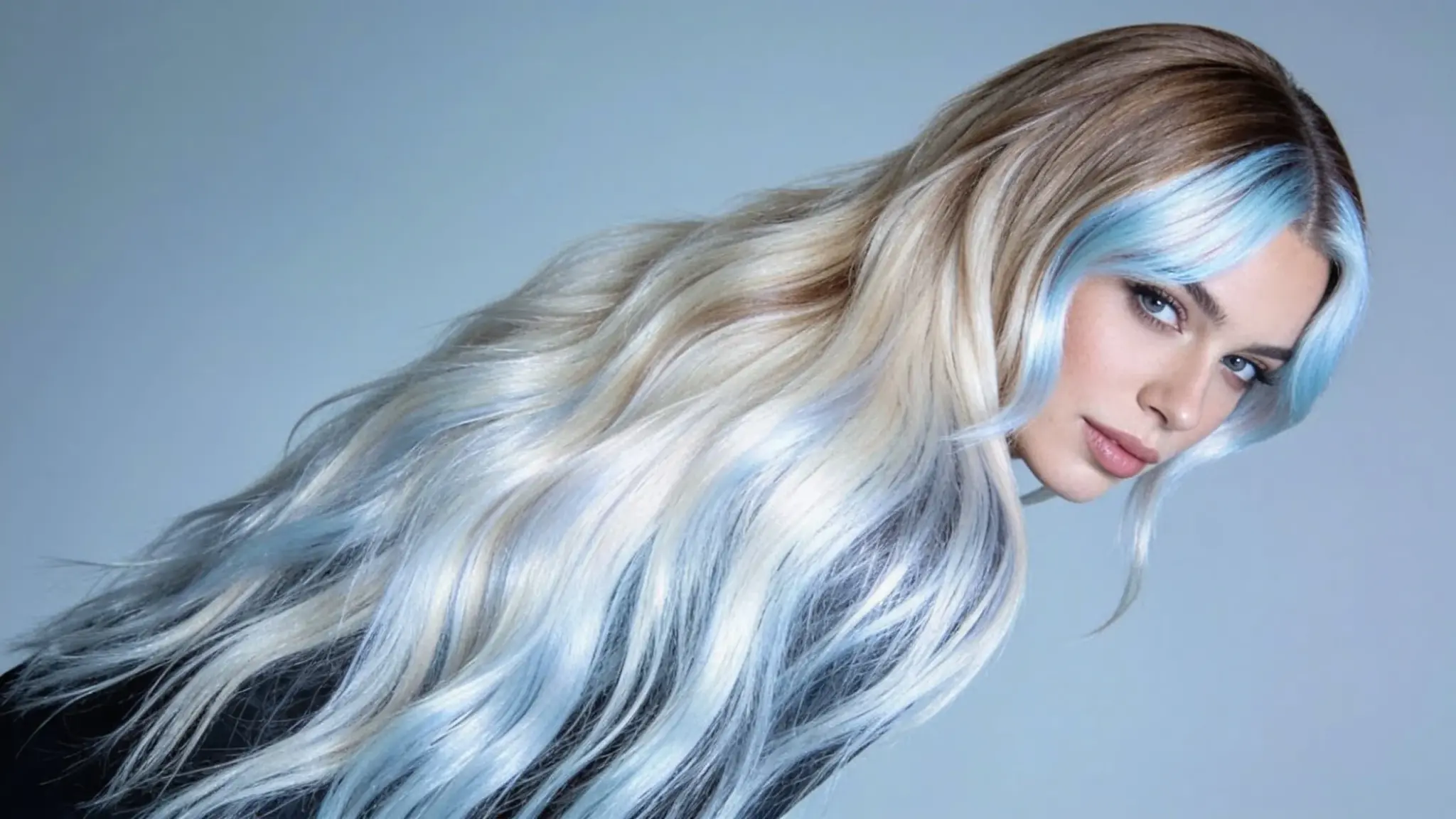 icy blonde balayage with cool platinum tones on long flowing hair with soft dimensional highlights
