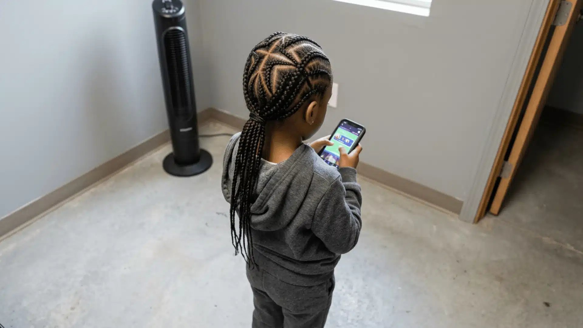 Mixed boy with stitch braids and sharp sectioned parts across the scalp