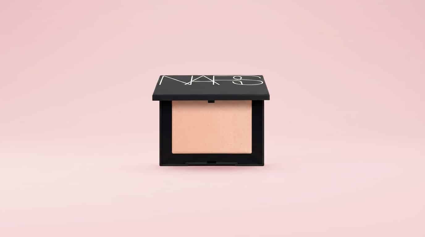 nars light reflecting pressed setting powder displayed inside an open makeup compact