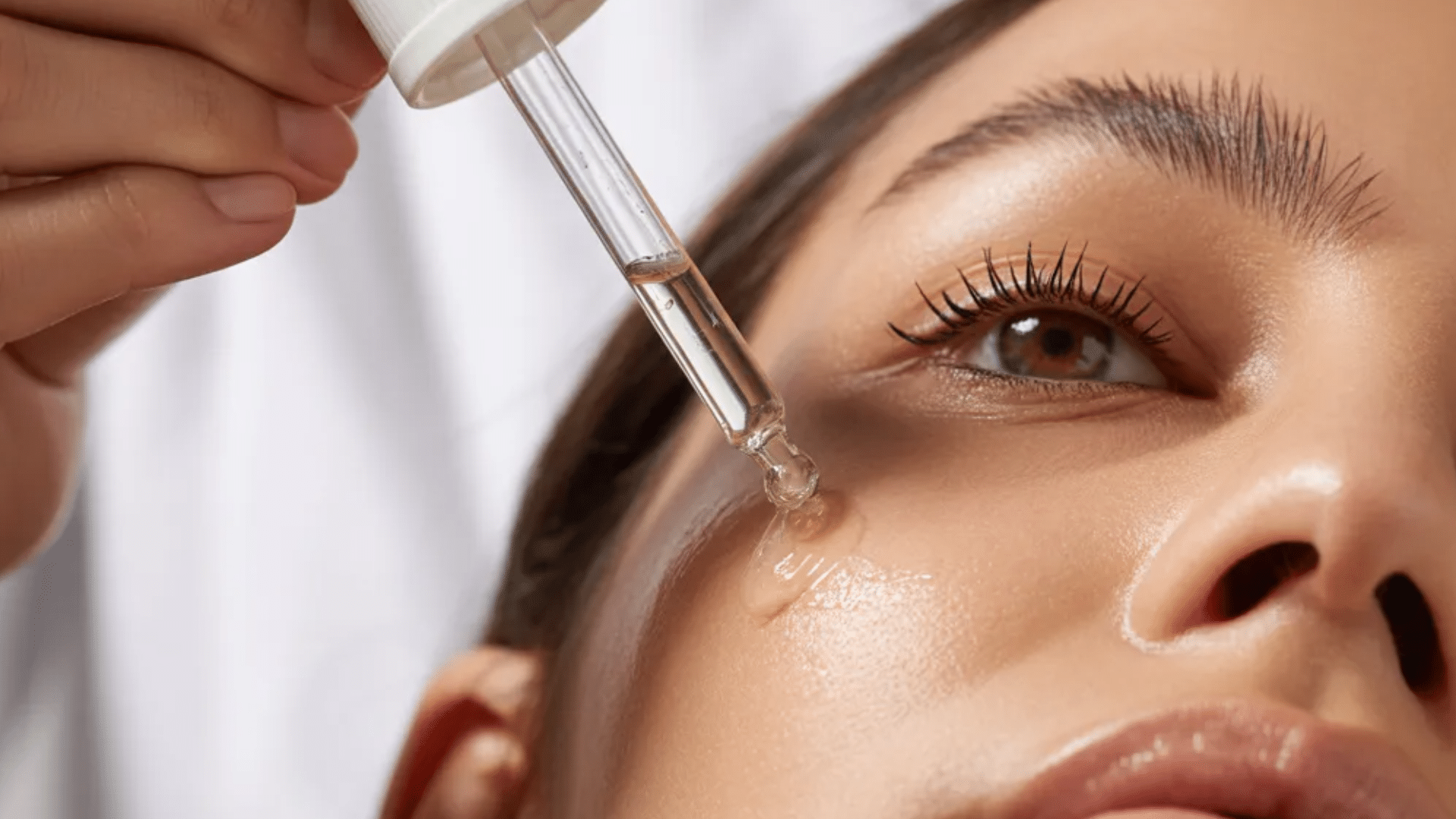 person applying skin renewal serum with skincare routine for improving textured skin appearance
