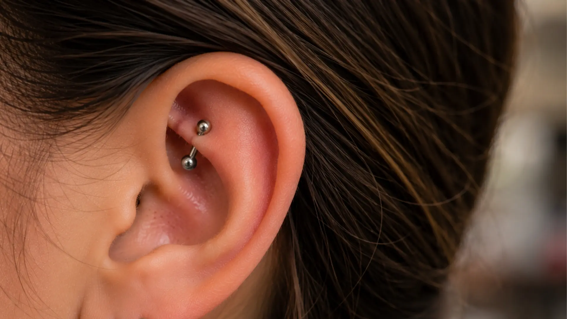 Rook piercing with curved barbell