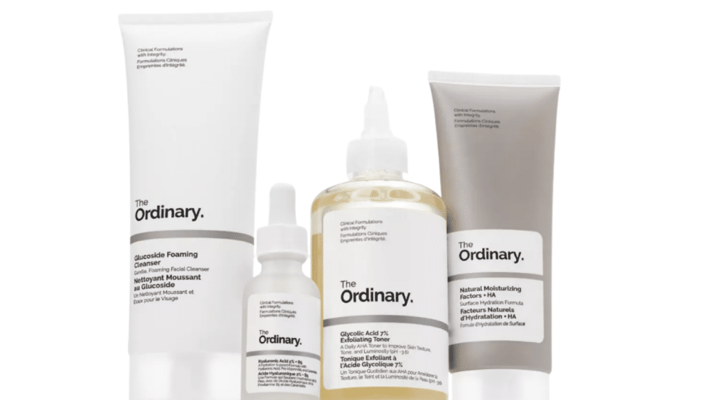 the ordinary skincare products arranged together with cleanser serum toner and moisturizer bottles on white background