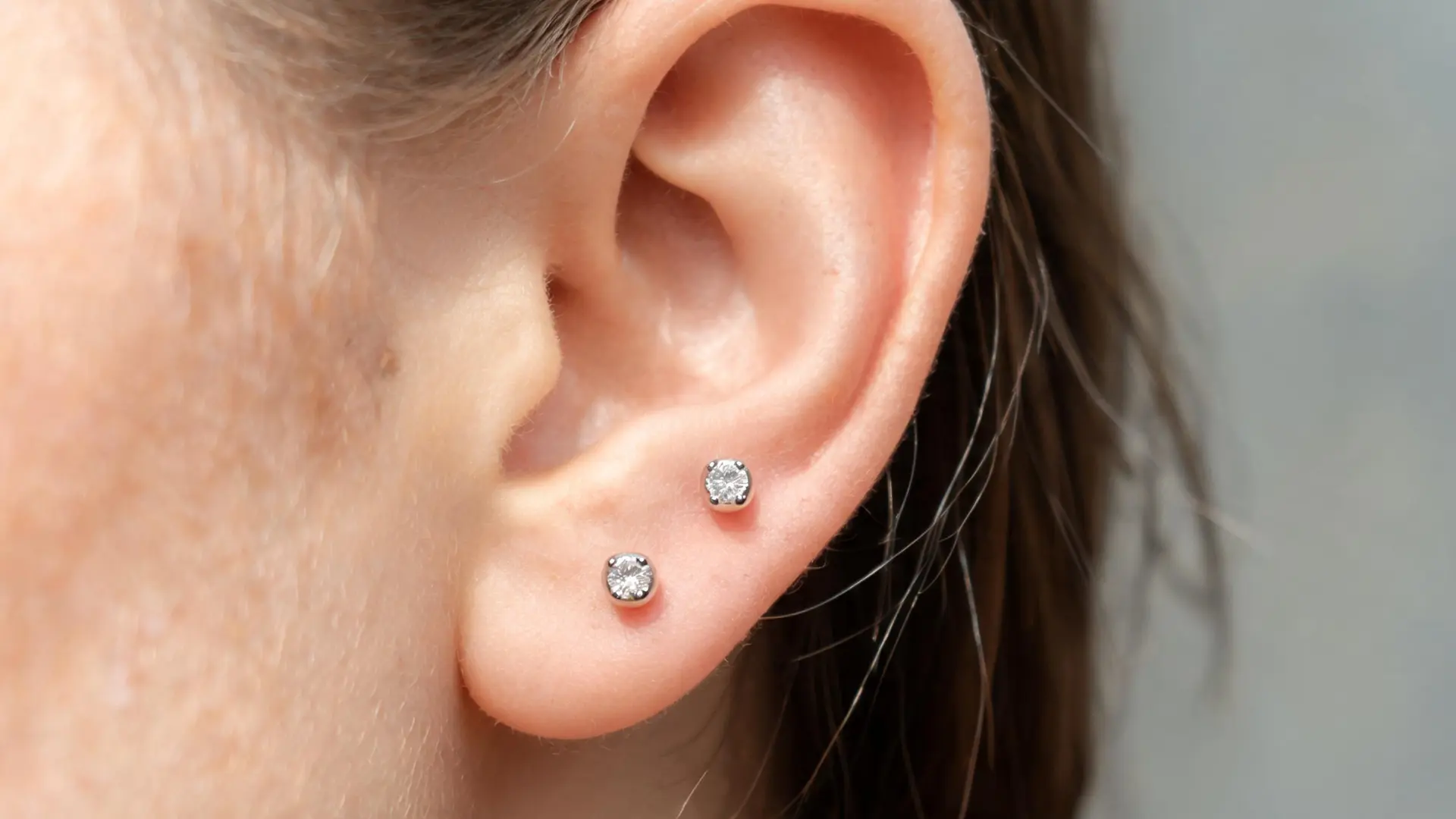 Upper lobe piercing with stacked earrings