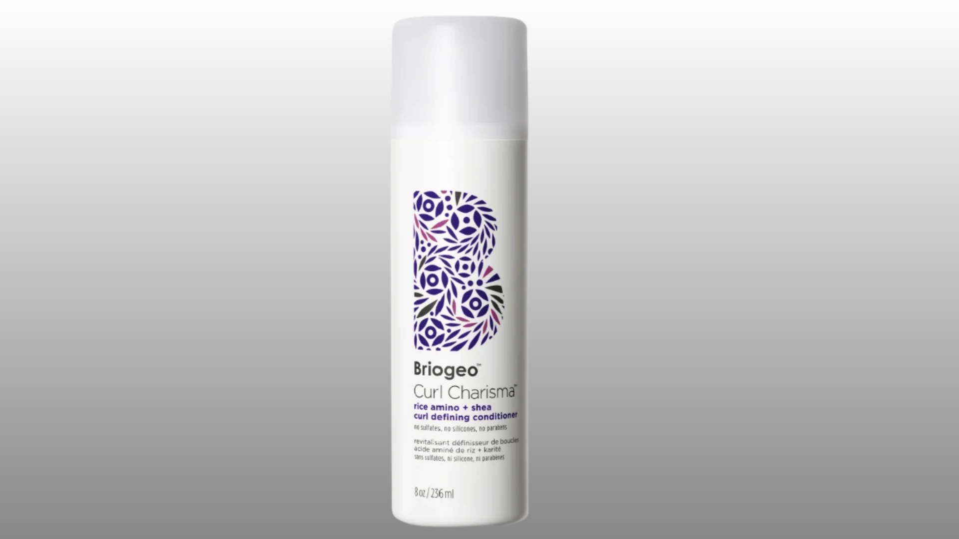 white briogeo curl defining conditioner bottle with floral label on gray background for hair care product display