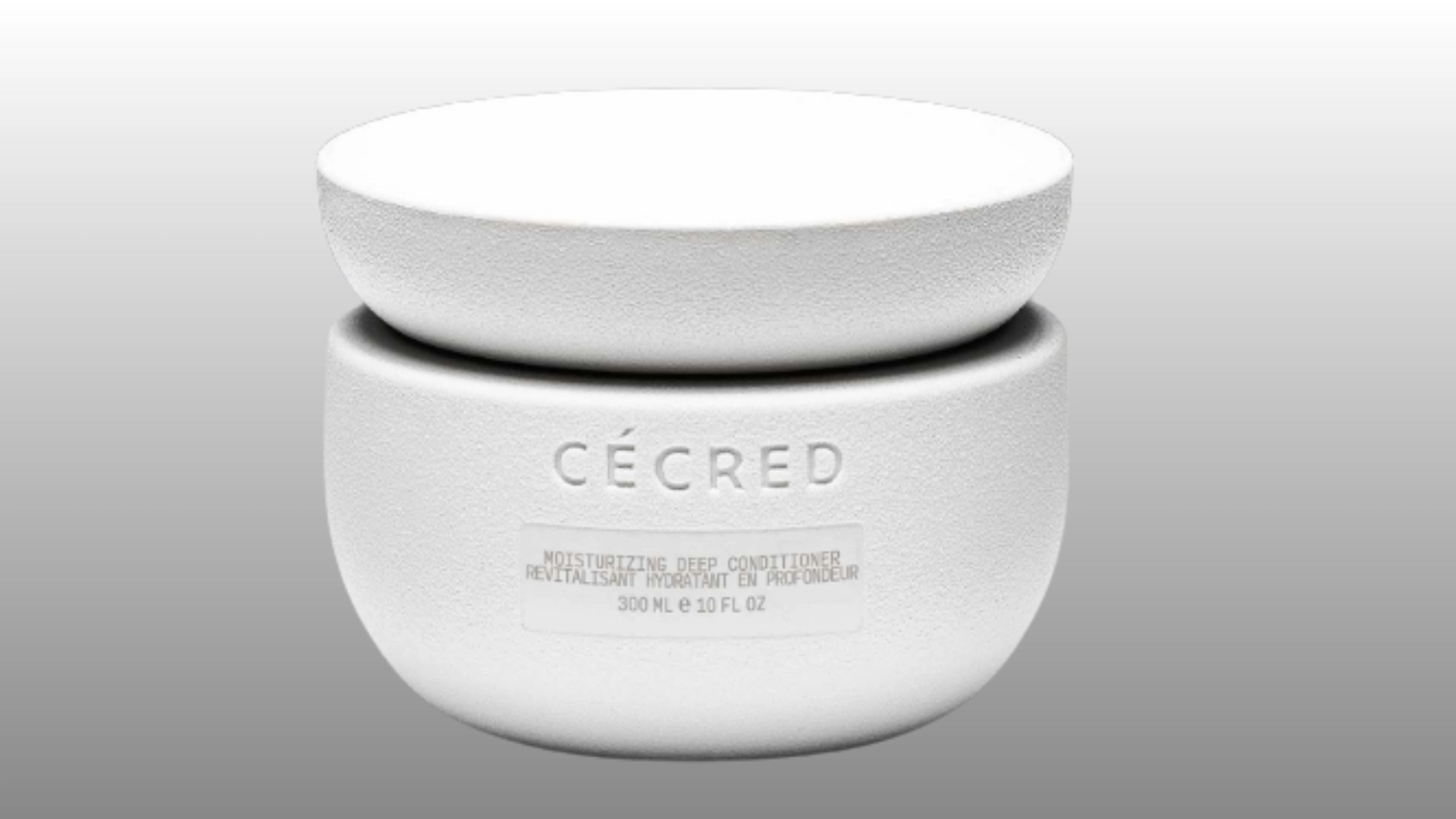 white moisturizing deep conditioner jar with lid on gray background for hair care product display