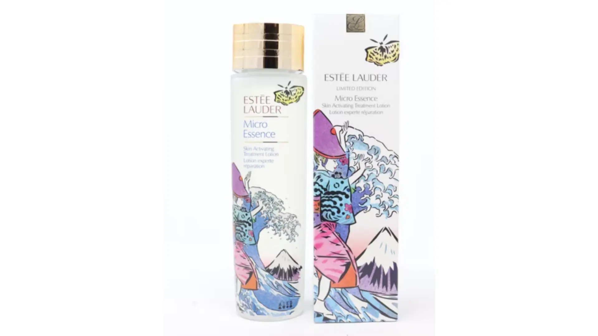 estée lauder micro essence lotion bottle with gold cap beside illustrated limited edition box on a white background