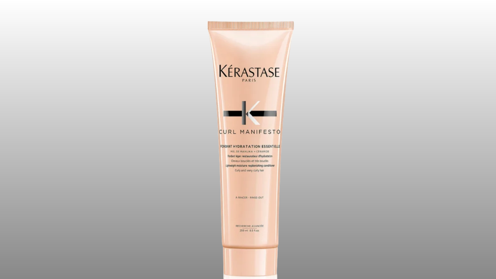 kerastase curl manifesto conditioner tube with peach packaging on gray background
