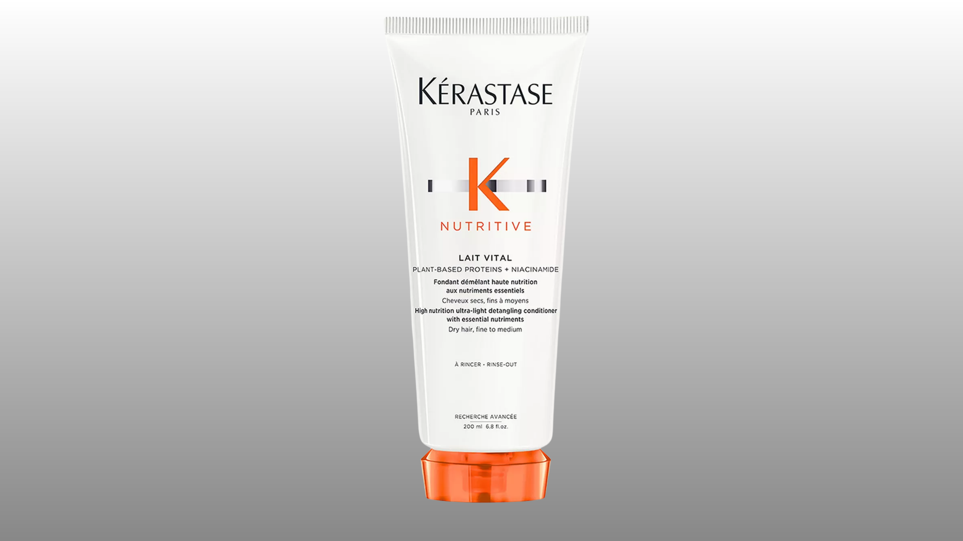 kerastase nutritive conditioner tube with white packaging and orange cap on gray background for hair care product display