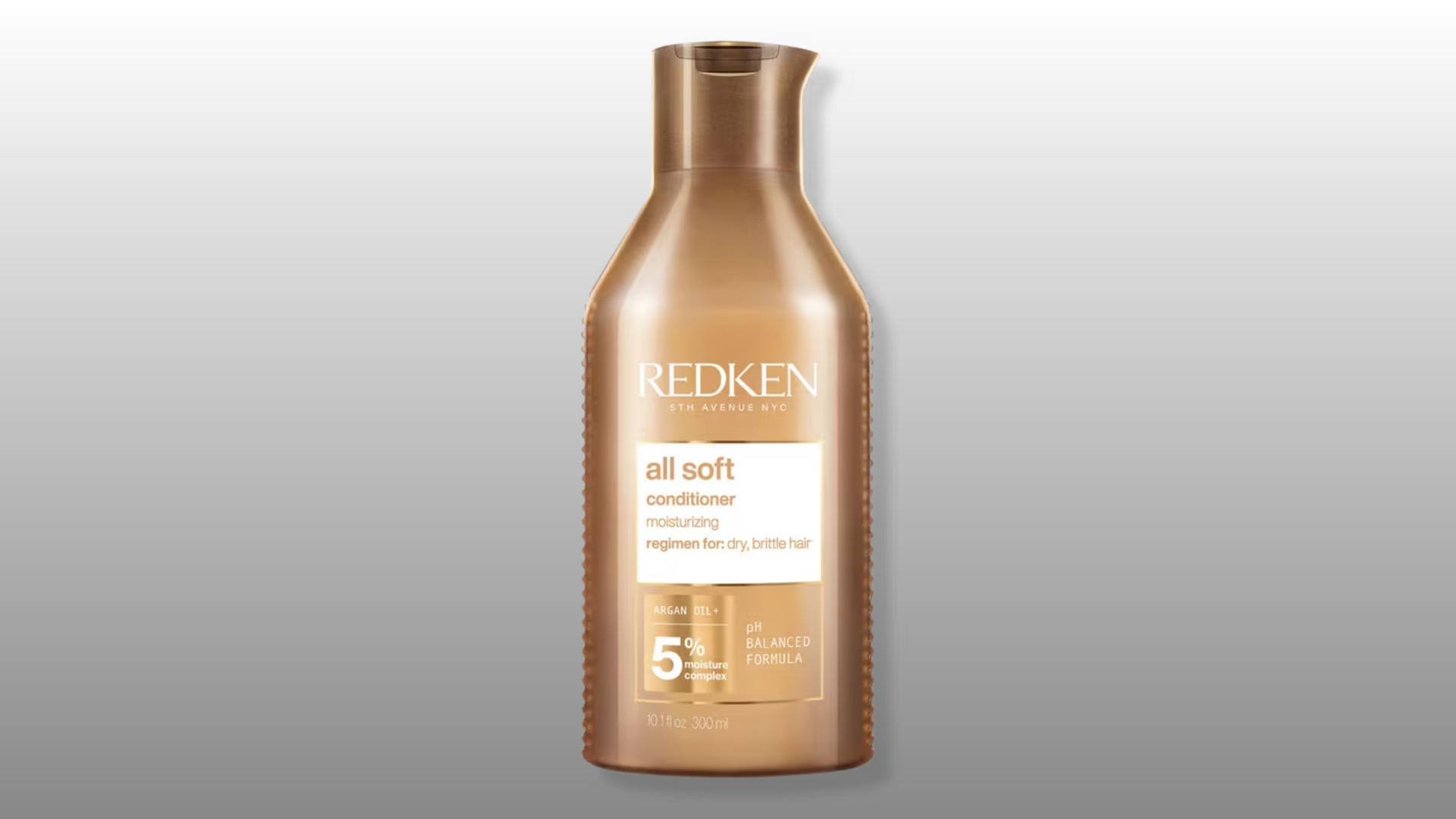redken all soft conditioner bottle with gold packaging on gray background for hair care product display