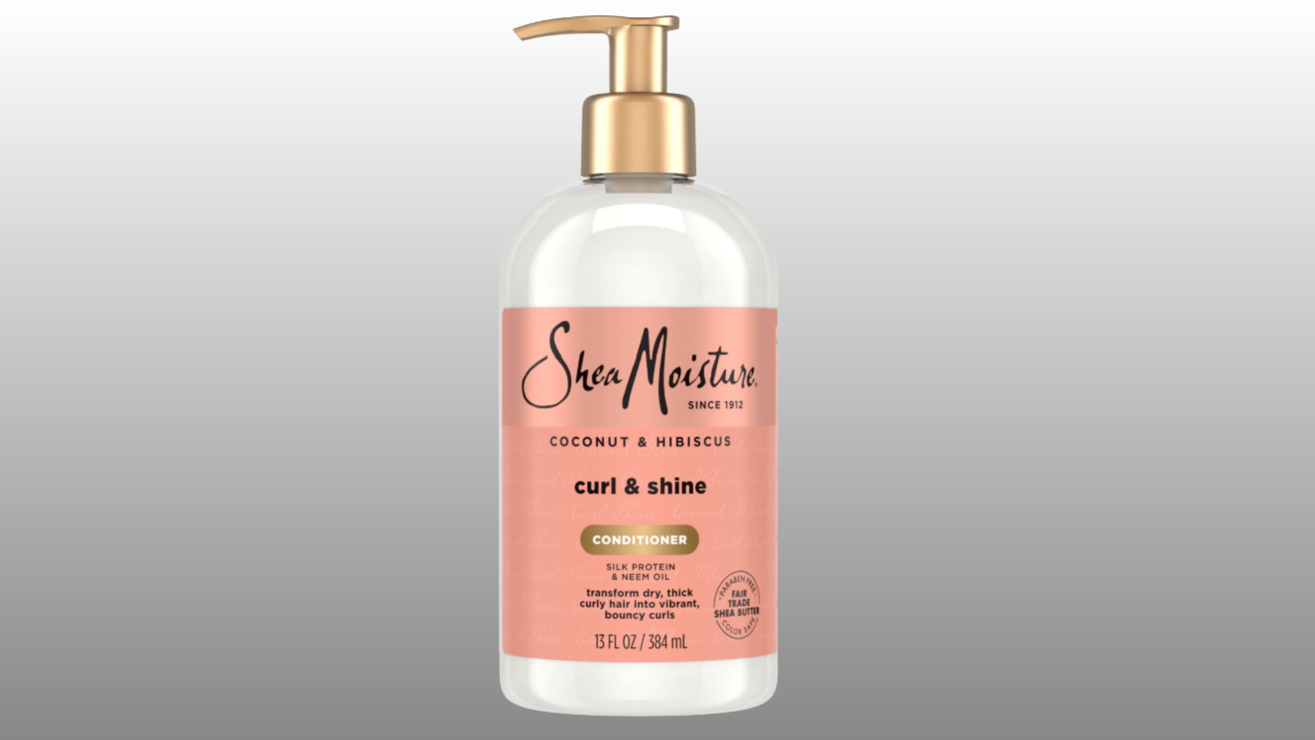 shea moisture curl and shine conditioner bottle with pump dispenser on gray background for hair care display